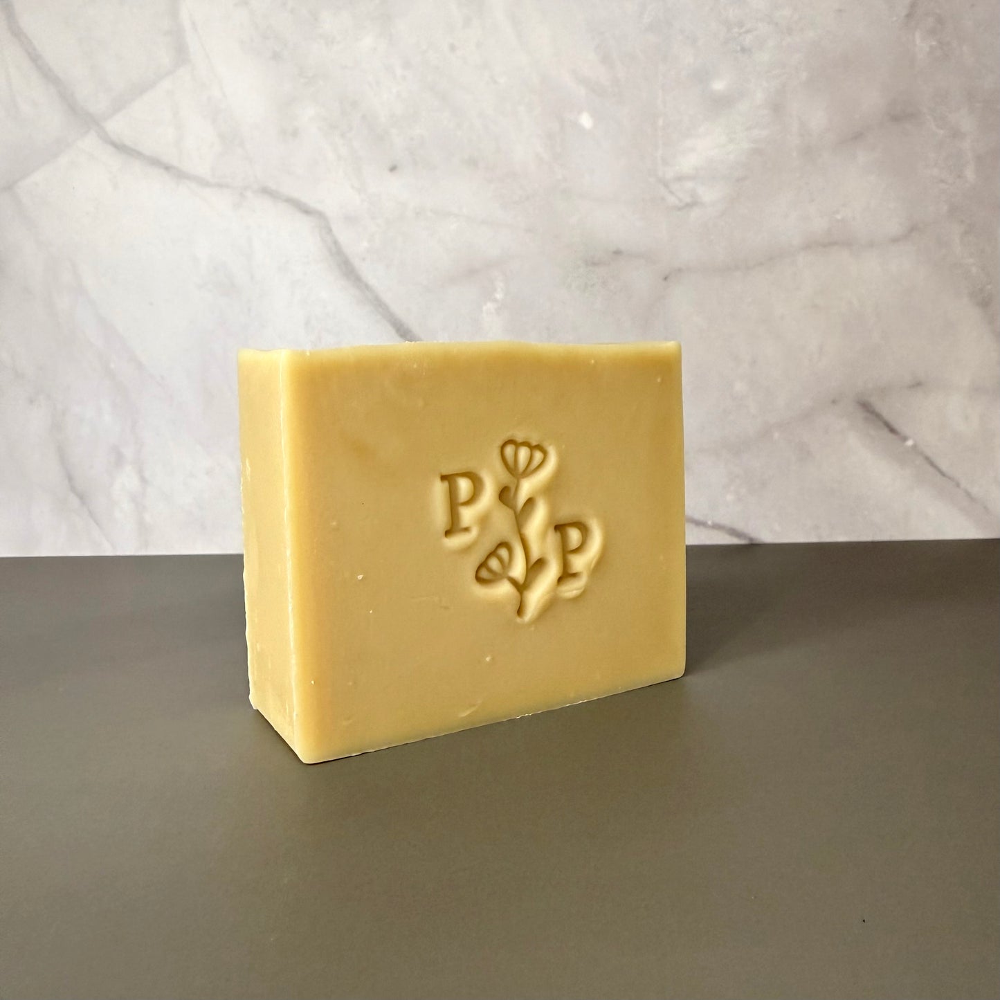 Handcrafted soap bar named Oat Essence, natural uncolored bar made with oats, smooth matte finish, fragrance-free