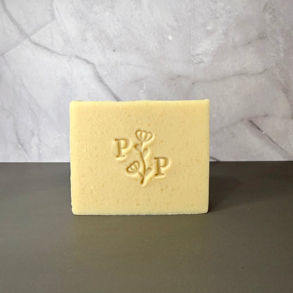 Handcrafted soap bar named Milk Essence, natural uncolored bar made with milk, smooth matte finish, fragrance-free