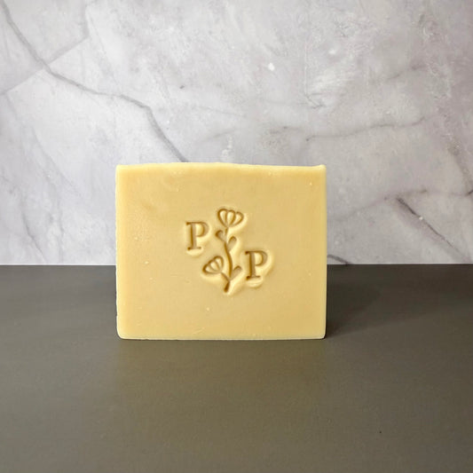 Handcrafted soap bar named Oat Essence, natural uncolored bar made with oats, smooth matte finish, fragrance-free