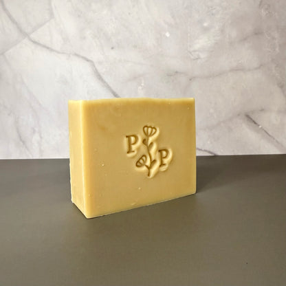 Handcrafted soap bar named Oat Essence, natural uncolored bar made with oats, smooth matte finish, fragrance-free