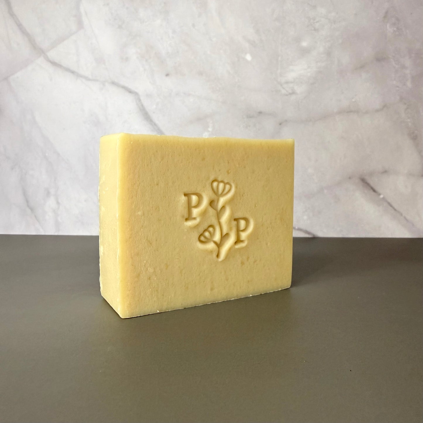 Handcrafted soap bar named Milk Essence, natural uncolored bar made with milk, smooth matte finish, fragrance-free