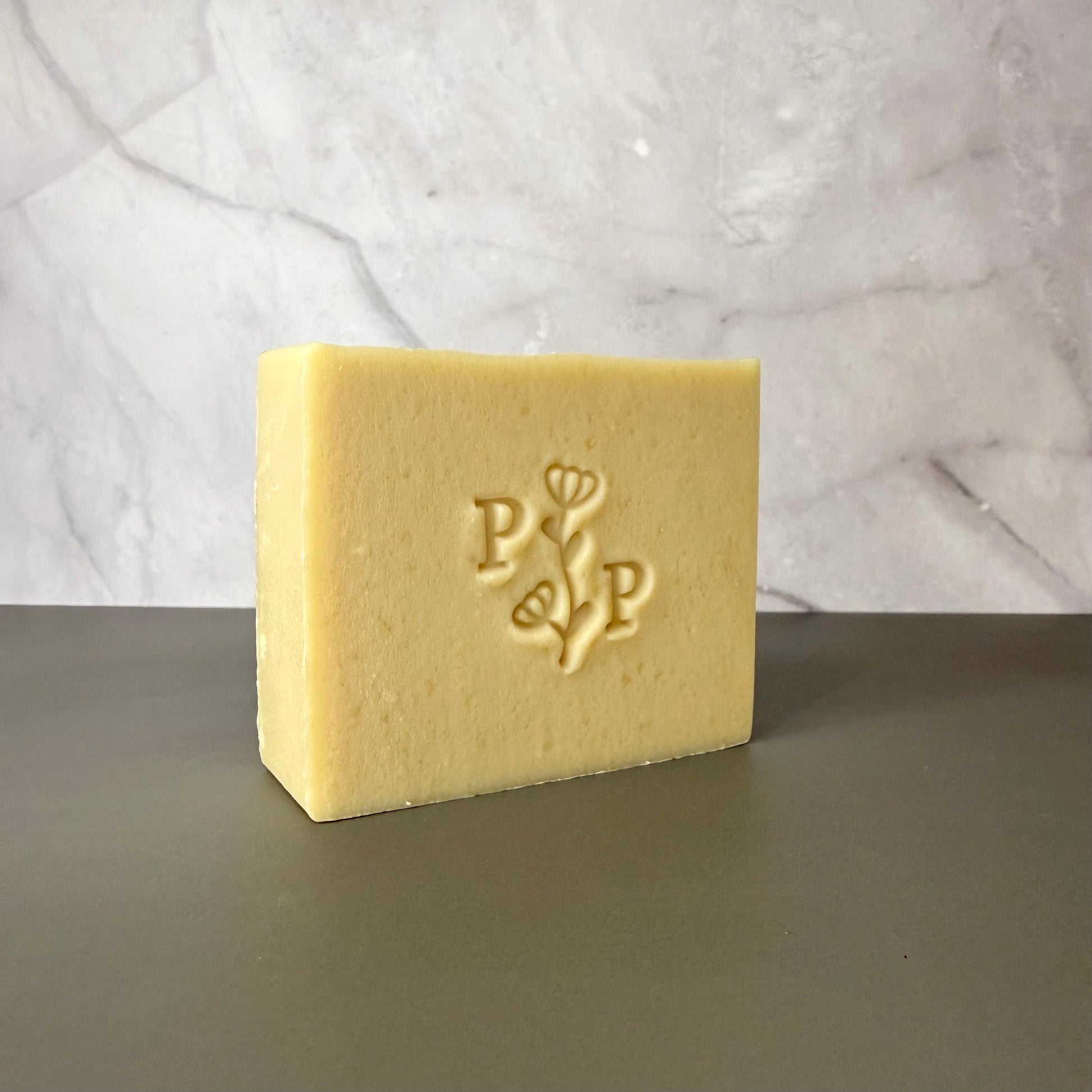Handcrafted soap bar named Milk Essence, natural uncolored bar made with milk, smooth matte finish, fragrance-free
